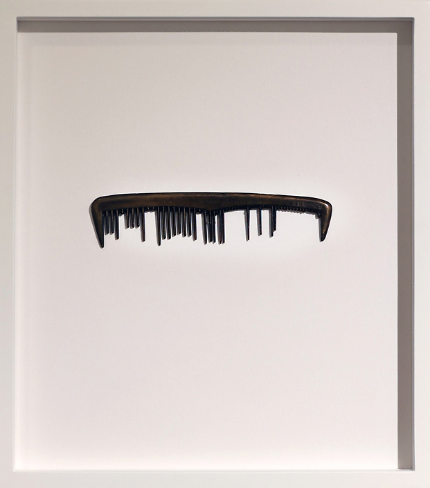 Sonya Clark - The comb never learned the name of the curl (framed detail), 2015, cast bronze 1" x 4.75" x .25" unframed 9.25" x 8.25" framed Unique Variant