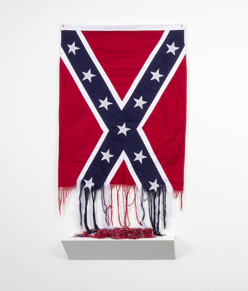 Sonya Clark - Unraveling, 2015, cotton Confederate battle flag, 70 by 36 by 7 inches