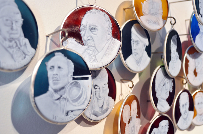 Charlotte Potter - Capturing Light: A History of Photographers (detail), 2017, hand engraved glass, silver, tin, stainless steel, 3 by 3 inches each cameo, approximately 13 feet long