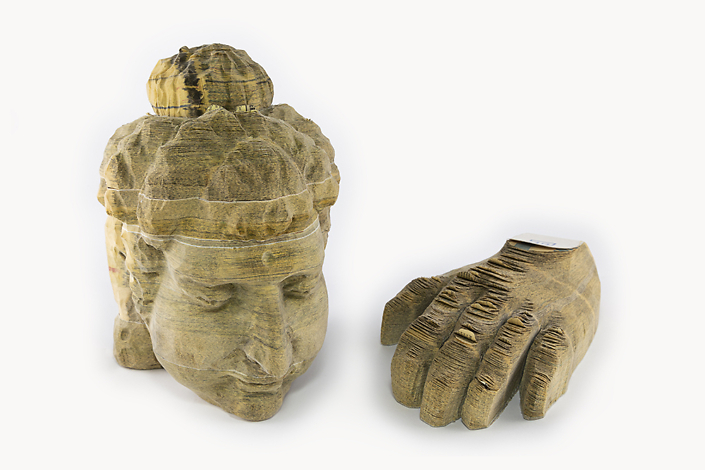 Long-Bin Chen - Indian Buddha and Hand (SOLD), 2006-2007, carved telephone books in two parts, head: 8 by 5 by 5.5 inches; hand: 2 by 5 by 7.75 inches