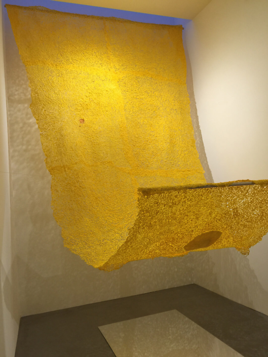 Neha Vedpathak - Nostalgia (installation), 2014, plucked Japanese handmade paper, jasmine scent, plexiglass mirror sheet, 108 by 60 inches (installation size: variable)