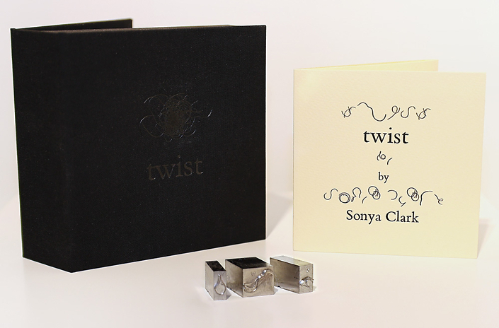 Sonya Clark - Twist (SOLD), 2022, Hair-based font lead type in hand made cloth bound box with pamphlet, 4.5” x 4.25” x 1.75”, Editioned