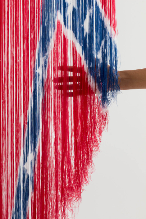 Sonya Clark - Untitled (detail), 2016, deconstructed nylon Confederate Battle Flag and flag pole, 104 by 24 by 8 inches