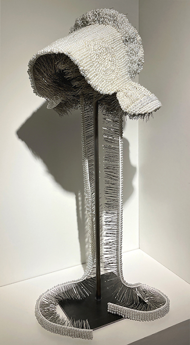 Angela Ellsworth - Seer Bonnet XXXI (Olive Grey), 2024, 12,360 pearl corsage pins, fabric, steel 28.5” x 12" x 13"